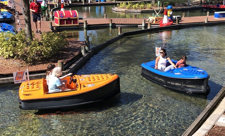 Families enjoying a day at a theme park