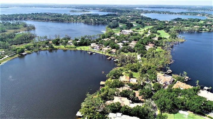 A beautiful aerial view of Windermere, Florida, showcasing the stunning landscape and community of the surrounding cities.