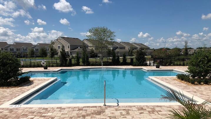Community pool and green spaces at Vineyards Windermere