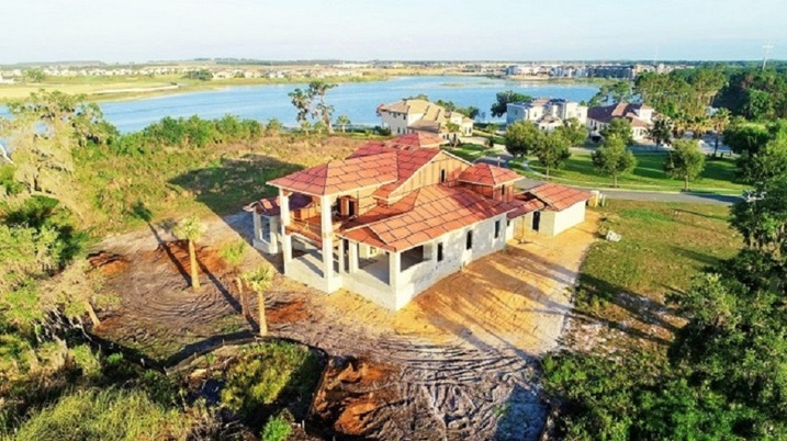 A picture of a family discussing financing options for a new home in Windermere, FL