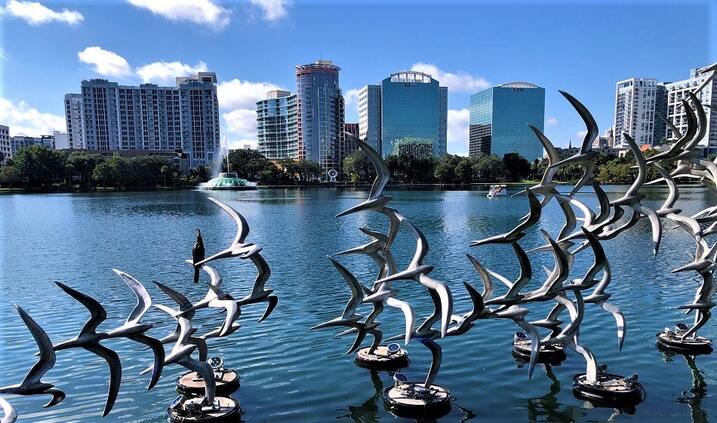 Windermere's serene lakeside lifestyle with Orlando's skyline in the distance