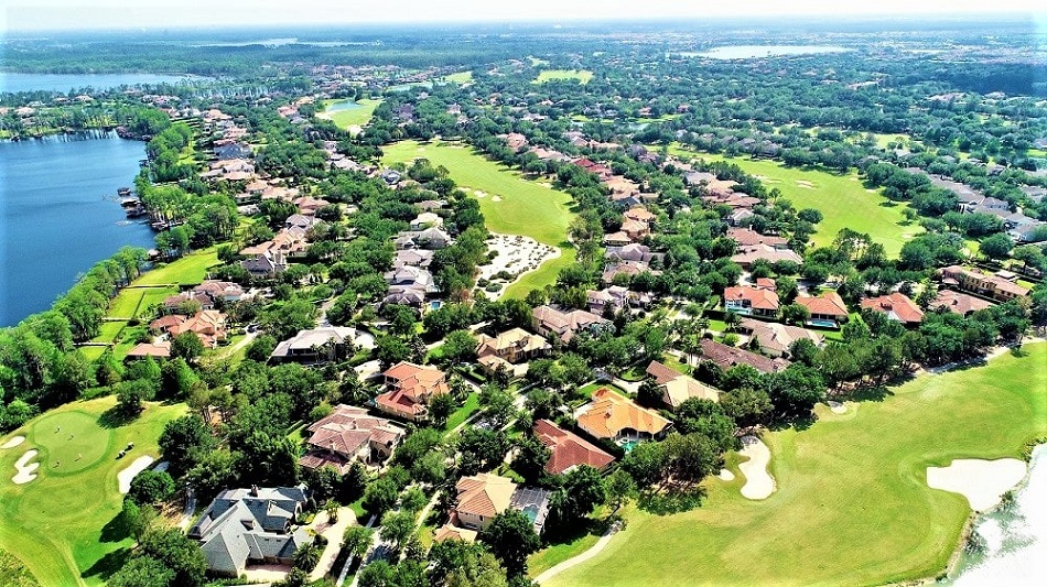 Aerial view of a luxurious golf course surrounded by lush greenery in Central Florida