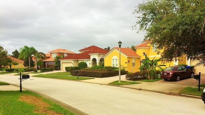 Families enjoying the clubhouse and playground at Belmere Village, fostering a vibrant community lifestyle