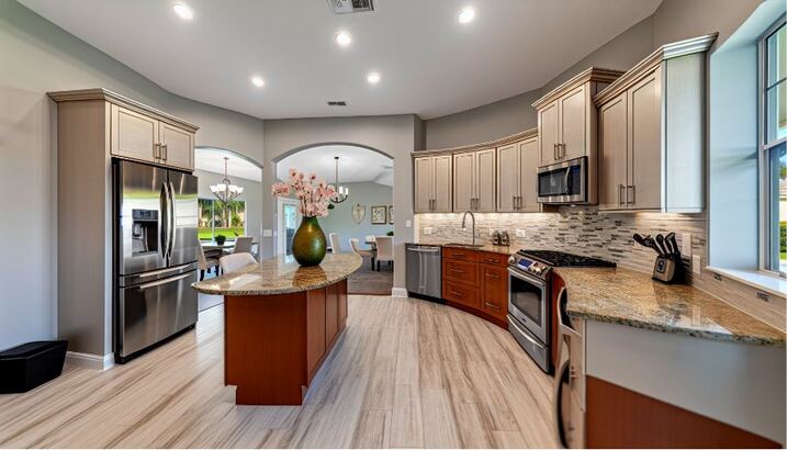 Spacious kitchen with granite countertops in a 5-bedroom home for sale in Windermere, FL
